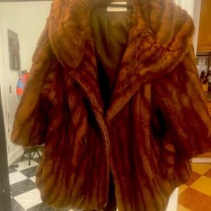 Gorgeous fur coat, small tear on side easy to mend.